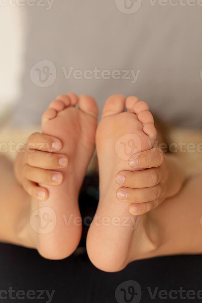 Close-up view of kid's feet. Child foot care, hygiene, correct footwear. Flat feet. Ideal for use in healthcare, pediatrics, and parenting-themed projects or advertisements. Foot problems, pain. photo