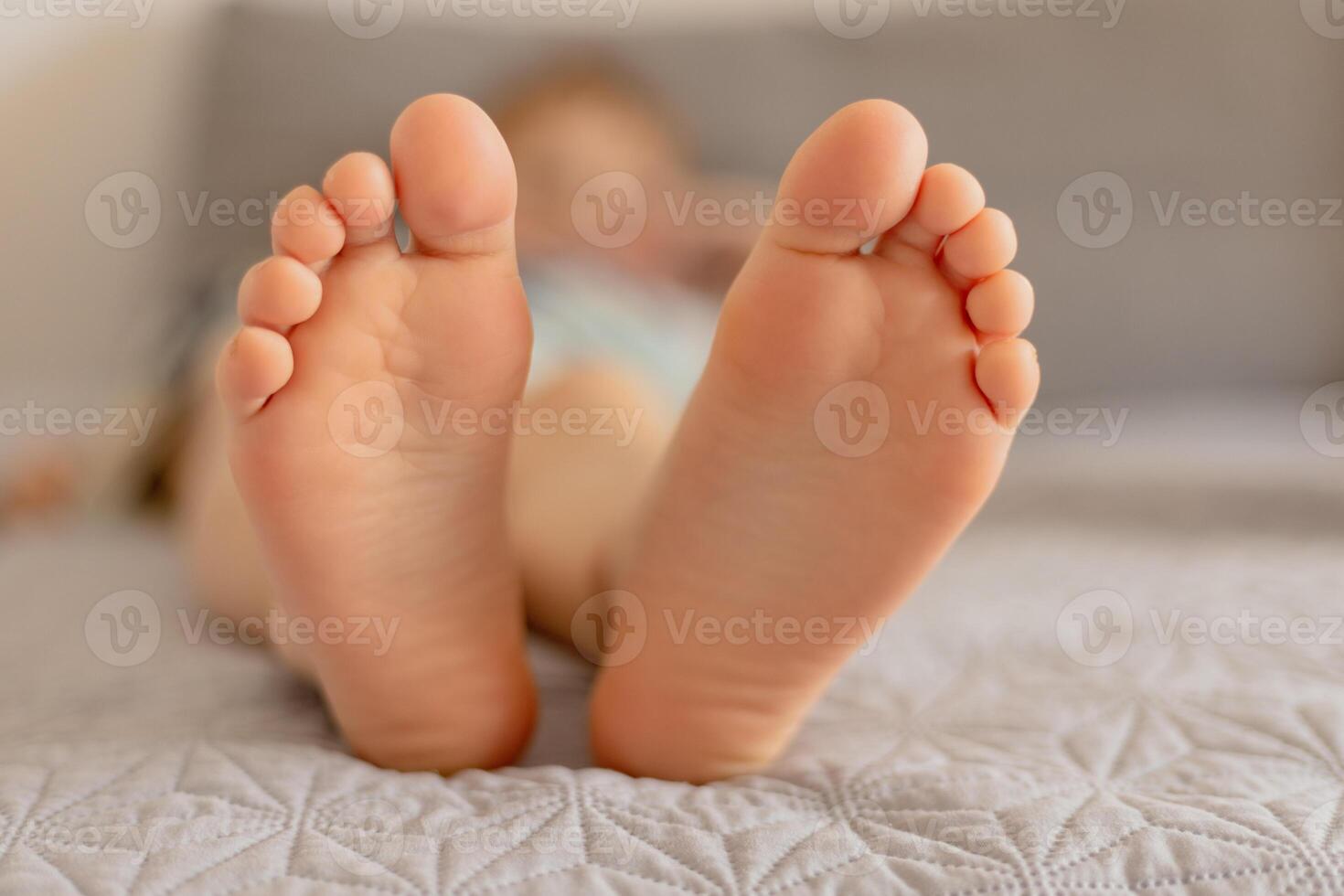 Close-up view of kid's feet. Child foot care, hygiene, correct footwear. Flat feet. Ideal for use in healthcare, pediatrics, and parenting-themed projects or advertisements. Foot problems, pain. photo