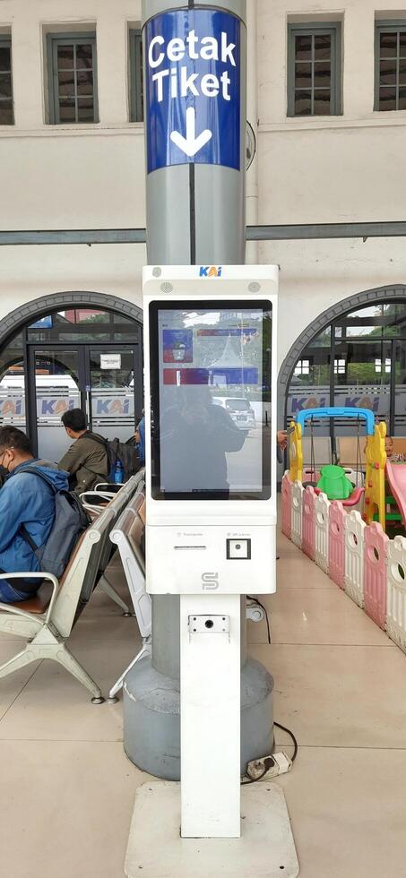 View of the Pasar Senen train station area. Local train and passengers activity. Jakarta, Indonesia - June 8, 2024 photo
