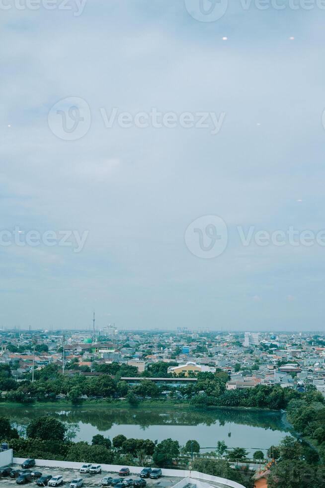 Cityscape featuring a beautiful man-made lake in the foreground photo