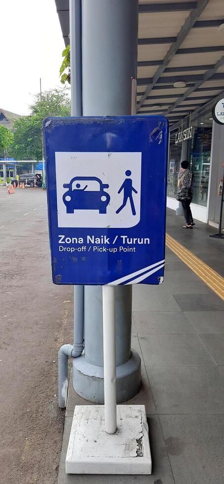 View of the Pasar Senen train station area. Local train and passengers activity. Jakarta, Indonesia - June 8, 2024 photo
