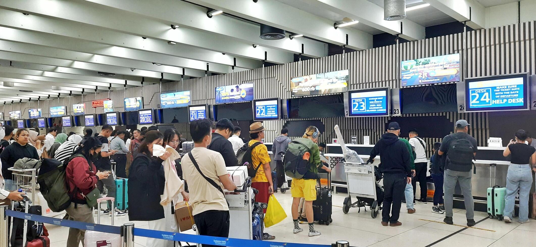 View of passengers activity and interior at terminal 1A Soekarno-Hatta International airport Jakarta, Indonesia - June 11 2024 photo