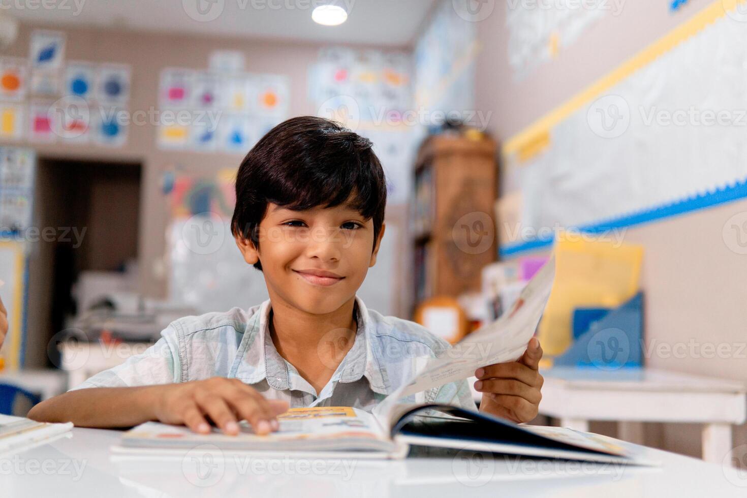 Portrait of latin american elementary child in a classroom. photo