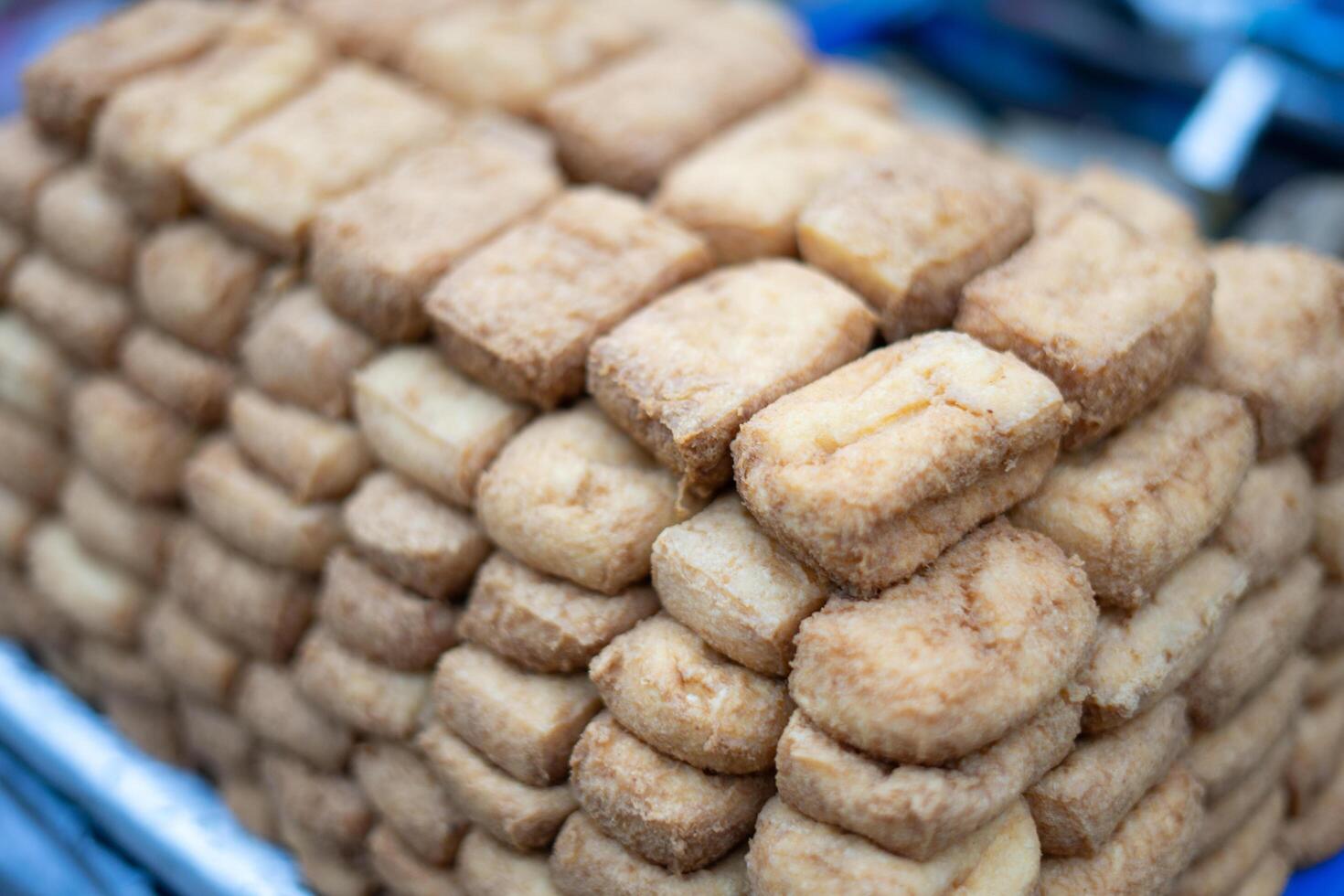 Brown Bandung tofu, ready for sale, showcases its rich color and delicious texture, perfect for adding flavor to any dish photo