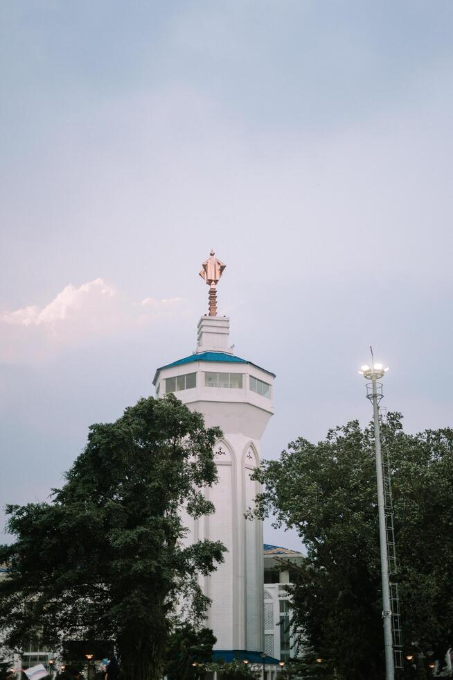 Bogor, Juy 21 2024. The minaret of the Great Mosque of Bogor rises majestically, showcasing intricate architecture and spiritual significance. photo