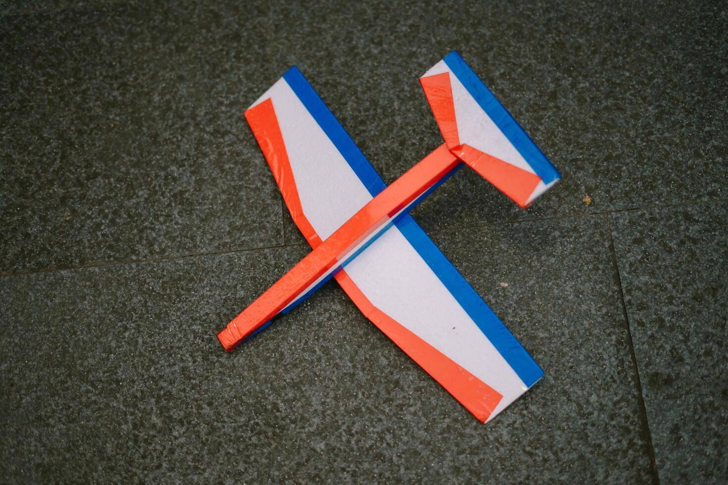 A toy airplane made of foam showcases its lightweight and durable design, perfect for playful and imaginative flight. photo