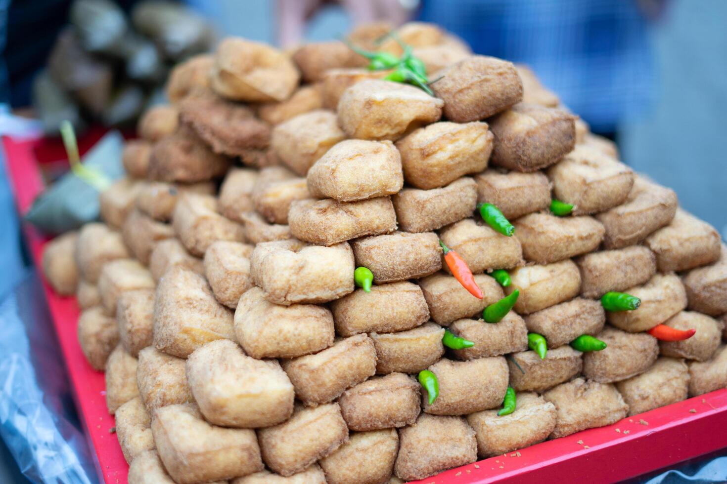 Brown Bandung tofu, ready for sale, showcases its rich color and delicious texture, perfect for adding flavor to any dish photo