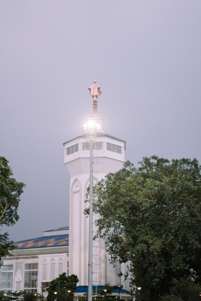 Bogor, Juy 21 2024. The minaret of the Great Mosque of Bogor rises majestically, showcasing intricate architecture and spiritual significance. photo
