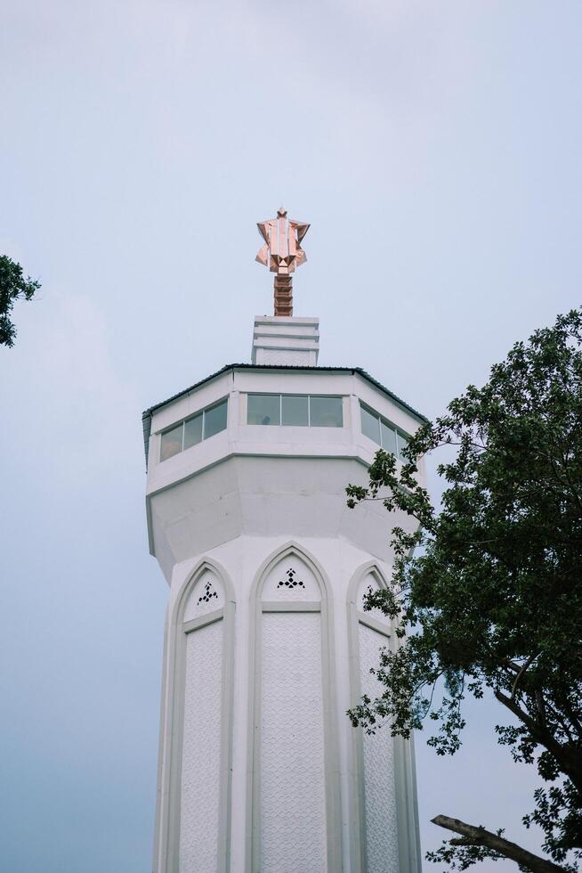 Bogor, Juy 21 2024. The minaret of the Great Mosque of Bogor rises majestically, showcasing intricate architecture and spiritual significance. photo