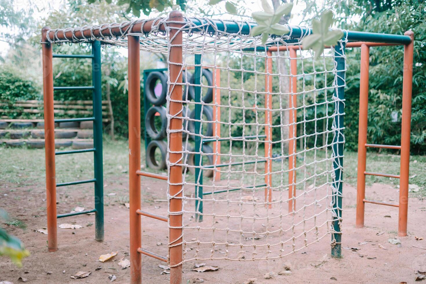 Kids' play area with metal frames and installed rope nets, perfect for climbing adventures. photo