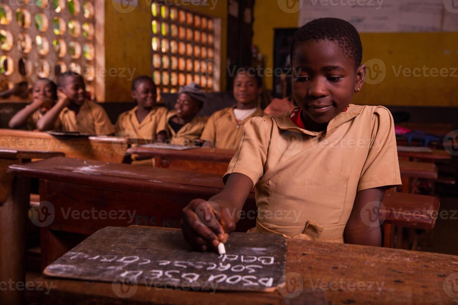 At an elementary school with black schoolchildren in the classroom. Study concept. photo