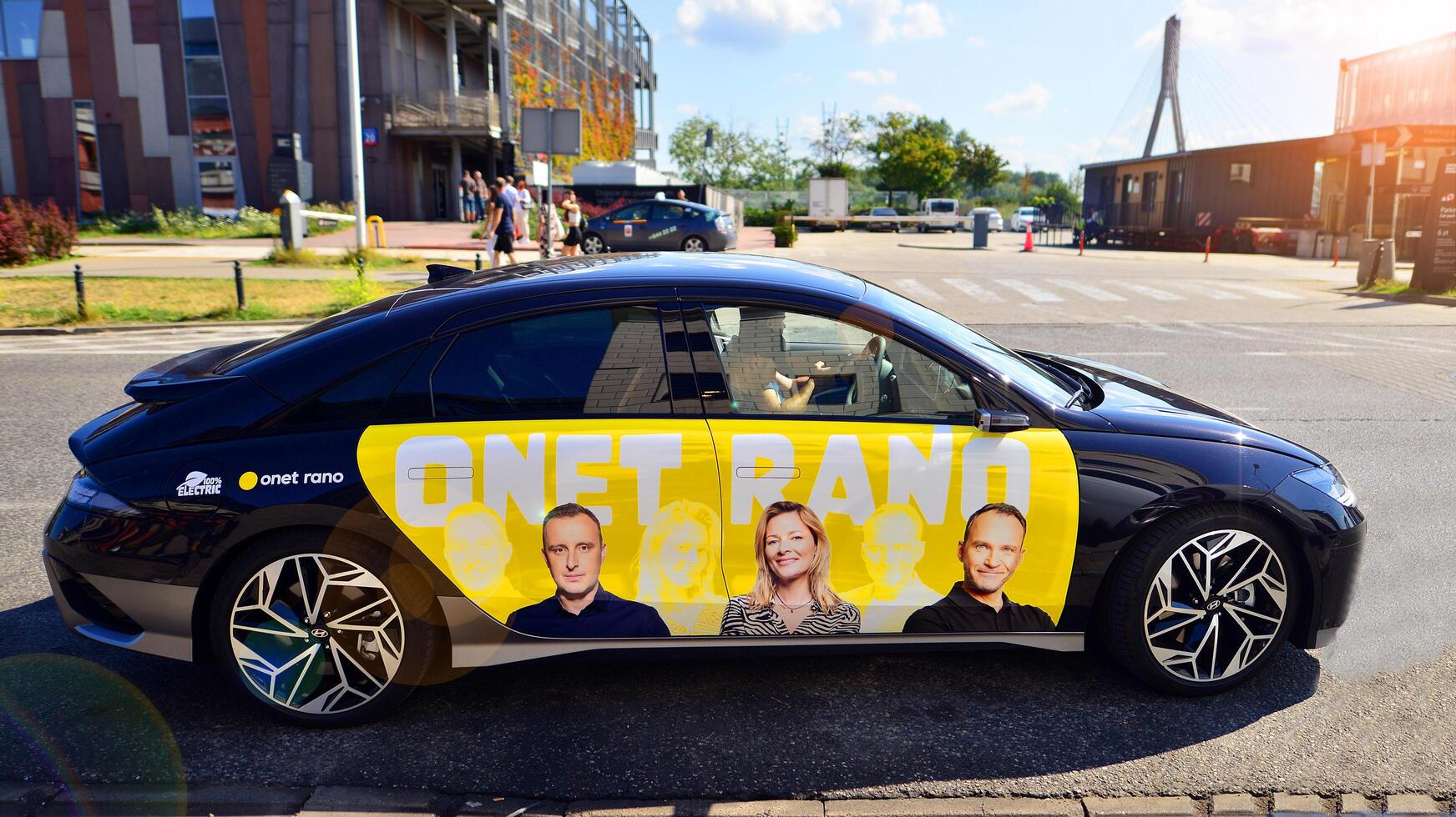 Warsaw, Poland. 9 July 2024. Onet.pl polish web portal logo on Hyundai electric car. Journalists conduct interviews while driving around the city. photo