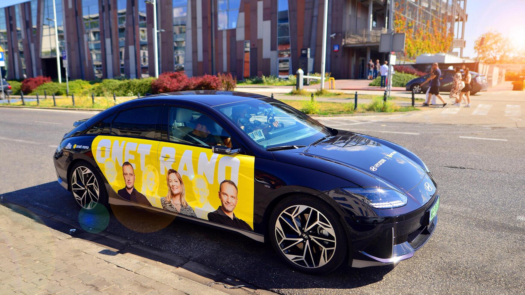 Warsaw, Poland. 9 July 2024. Onet.pl polish web portal logo on Hyundai electric car. Journalists conduct interviews while driving around the city. photo