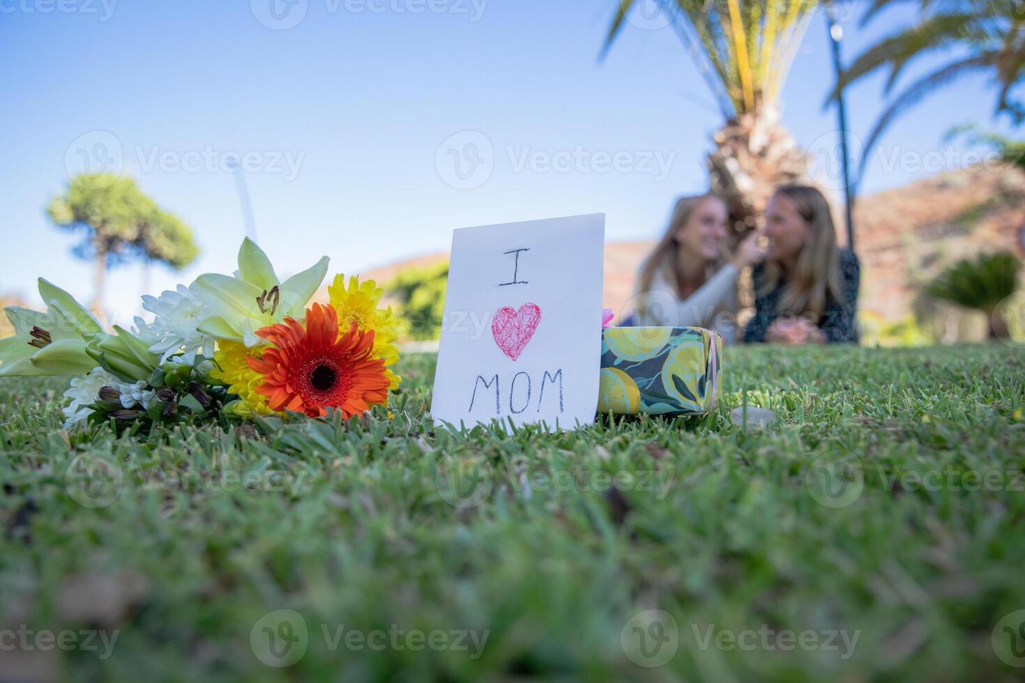 Gift and flowers given to her mother by her daughter to celebrate her on mother's day photo