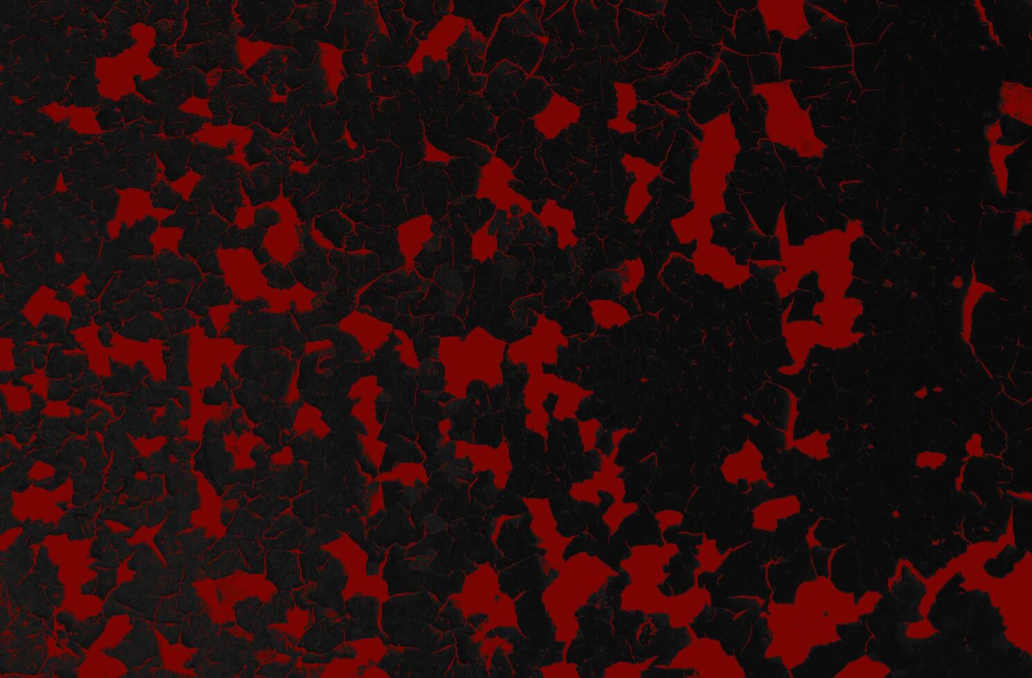 Halloween texture of cracks and wrinkles on cracked red surface photo