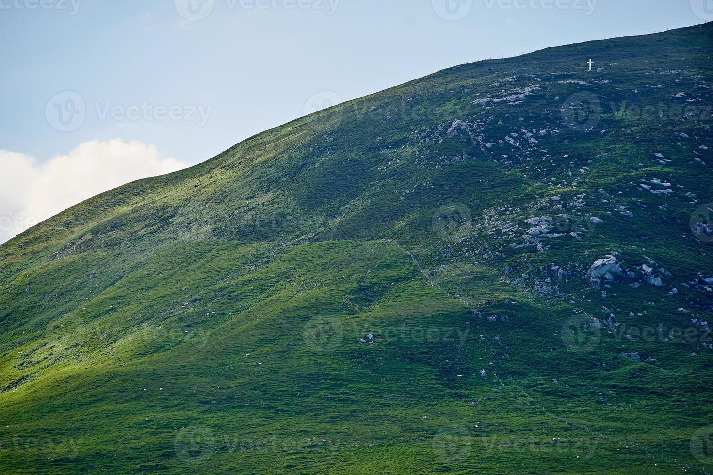 Ireland mountains cowered by clouds hiking trails farm land photo