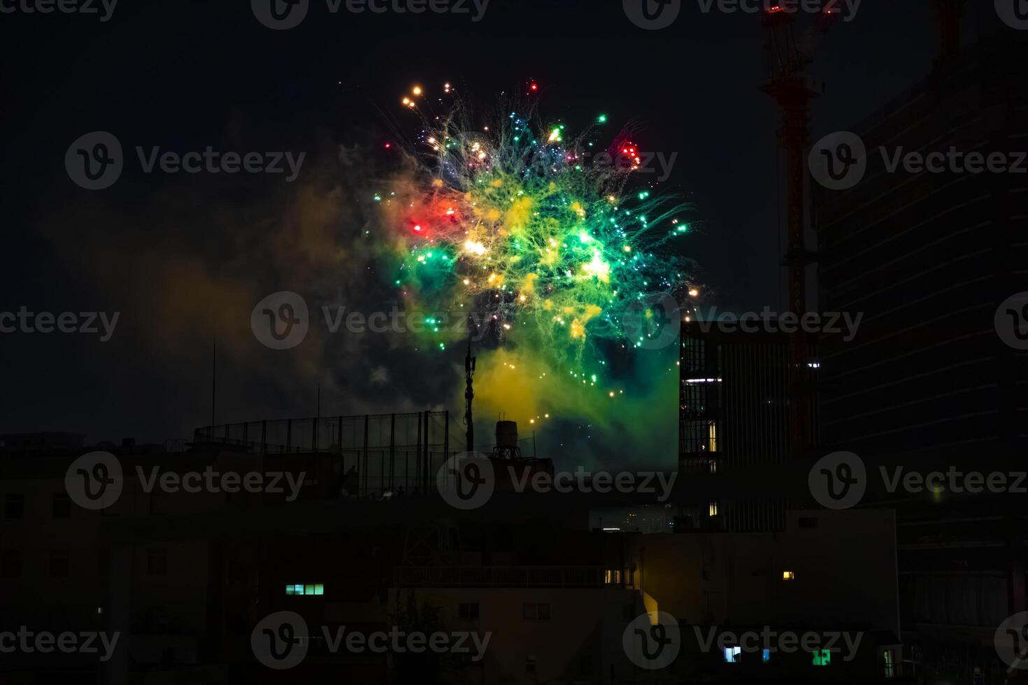 Fireworks near the building at the urban city in Tokyo at summer night photo