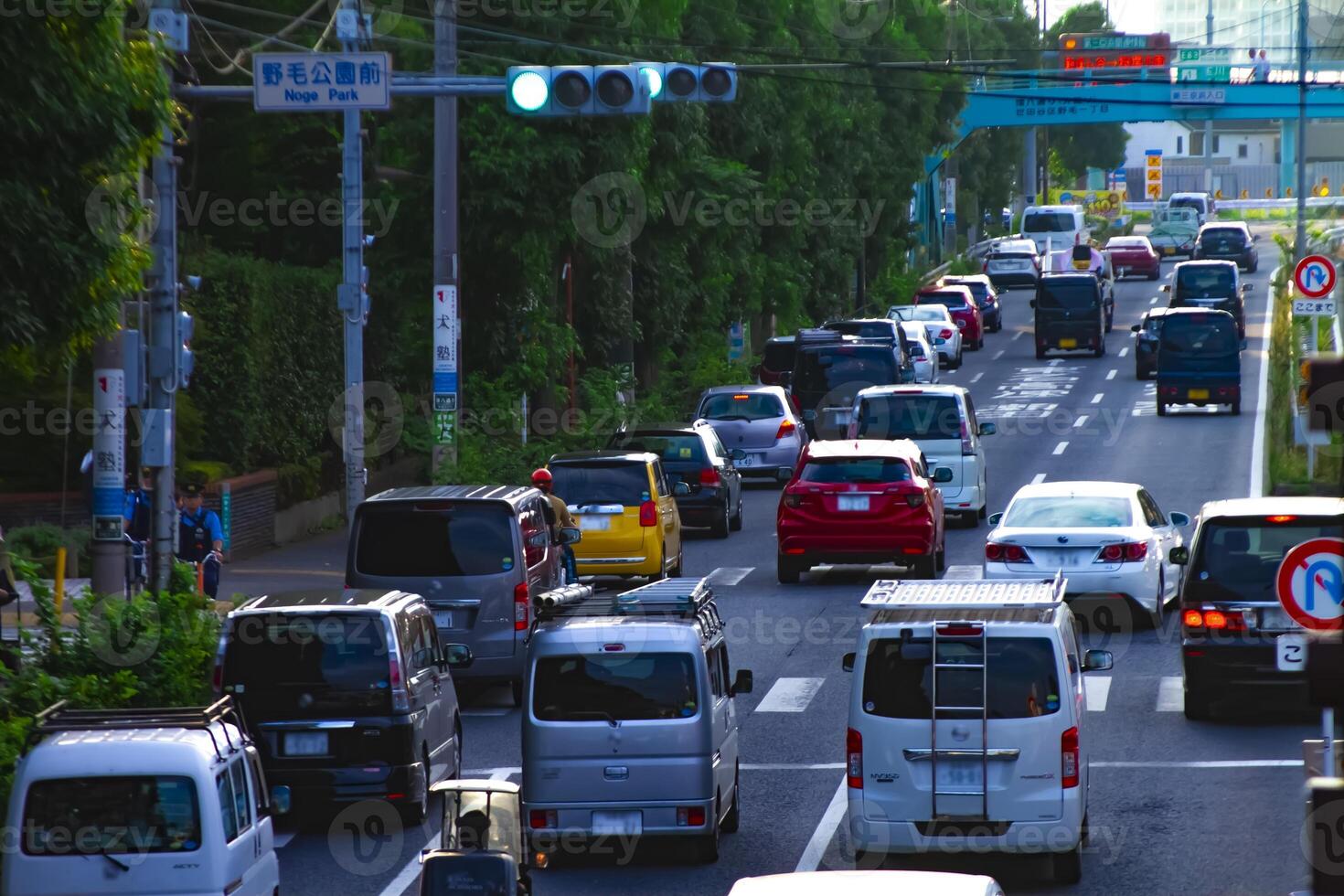 A downtown street at Kanpachi avenue in Tokyo daytime long shot photo