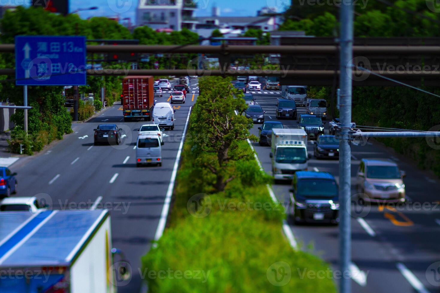 A downtown street at Kanpachi avenue in Tokyo daytime tilt-shift photo