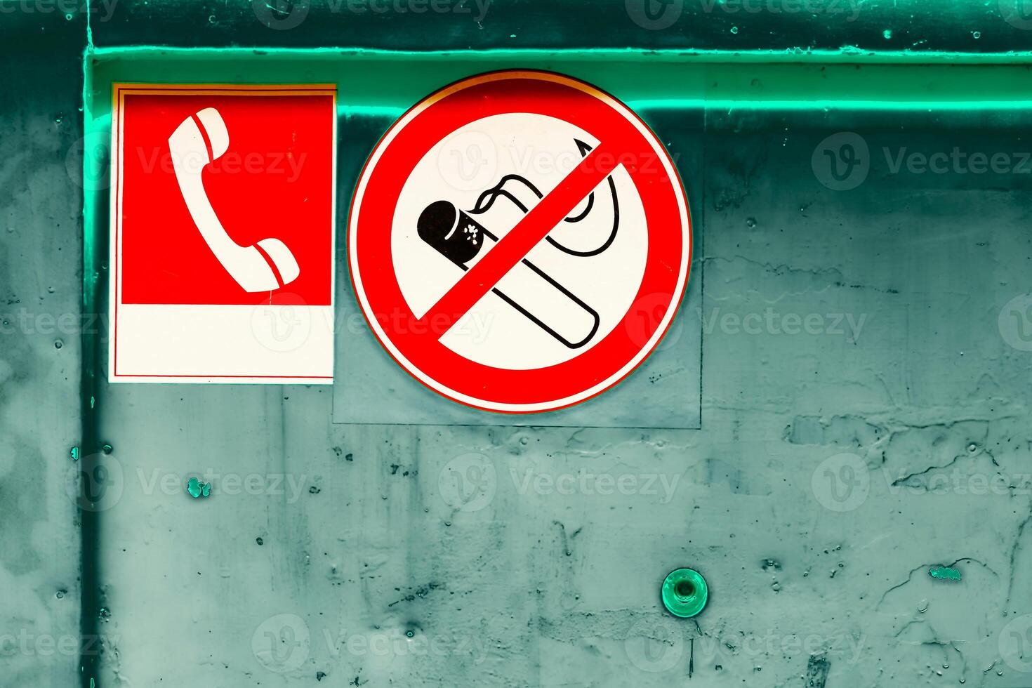 Prohibition sign no smoking, telephone sign on a dirty scratched green wall photo