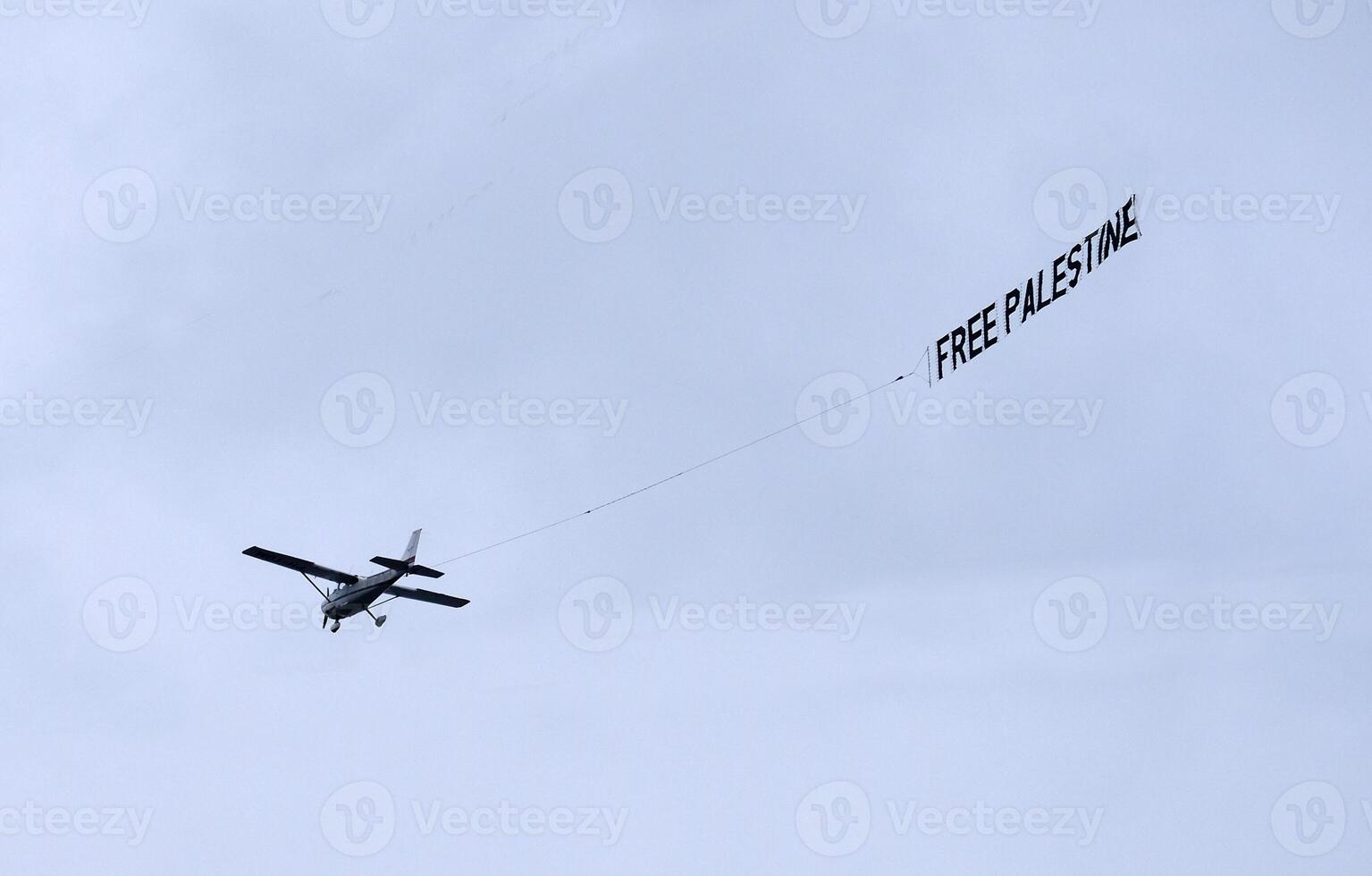 A plane with a Free Palestine banner in the sky photo