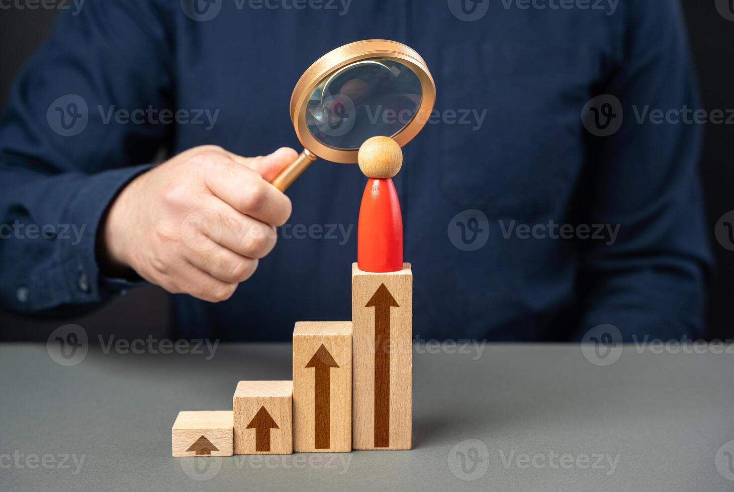 A businessman studies his opponent and his career growth story. Leadership skills. Take opponents place. photo