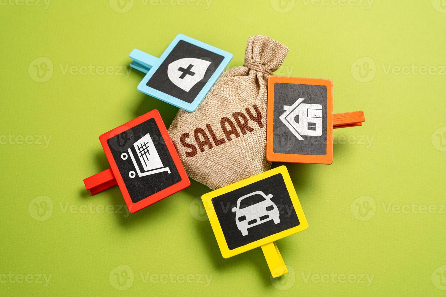 Salary and expenses. The money bag and attached signs symbolize expense items. Financial management and spending planning. Economics and business. Investments and diversification of funds. photo