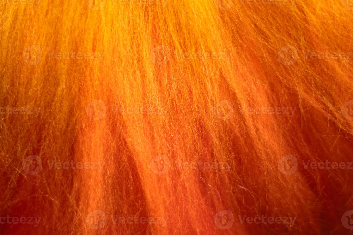 Close up of felting wool layers texture. Gradient from yellow to bright orange colors. Sheep carded wool laid out for felt project. Wet felting craft. Textile art background. Top view. Copy space. photo