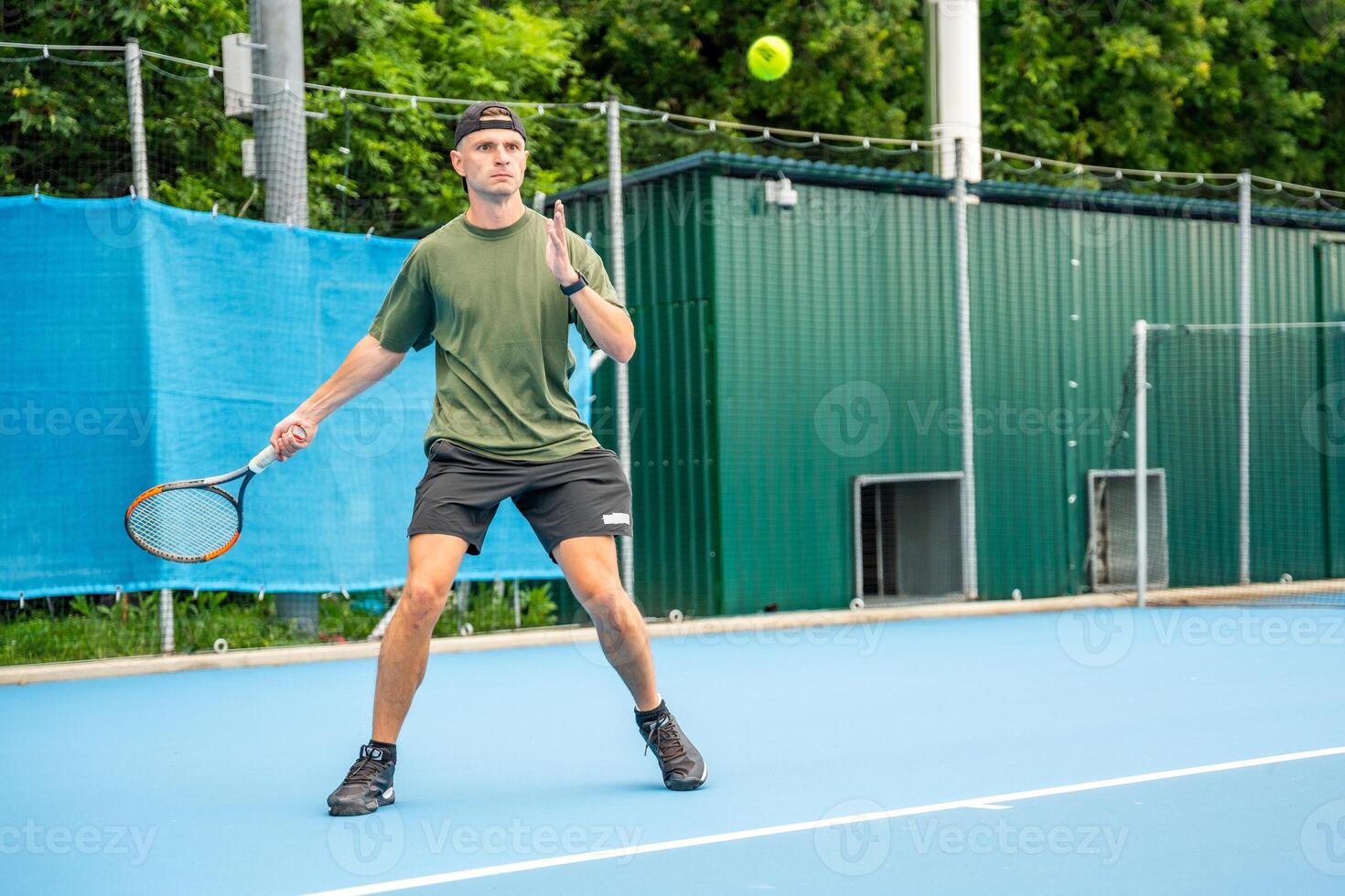 Professional male tennis player playing the tennis on outside court. High quality photo