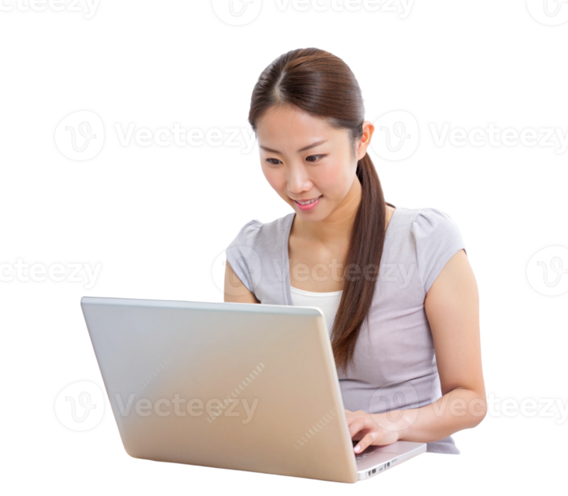 Smiling asian woman in traditional dress working on laptop at desk png