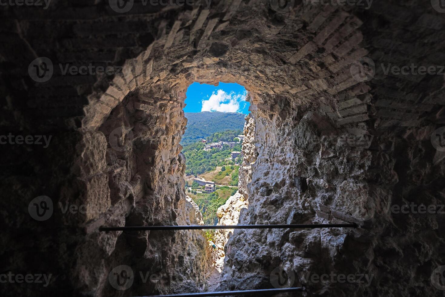 View through a castle window of the small Italian town of Tolfa photo