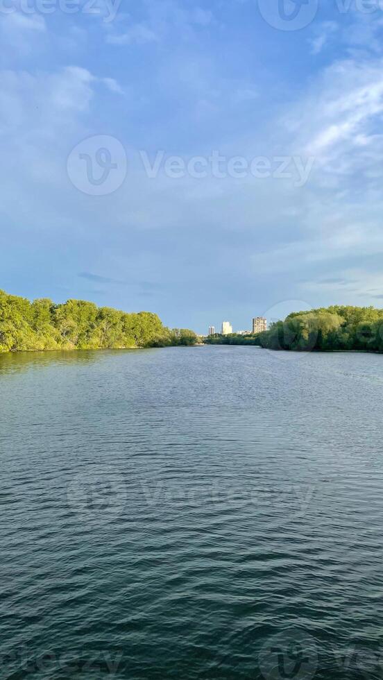 A landscape with a view of the river and the sunset photo