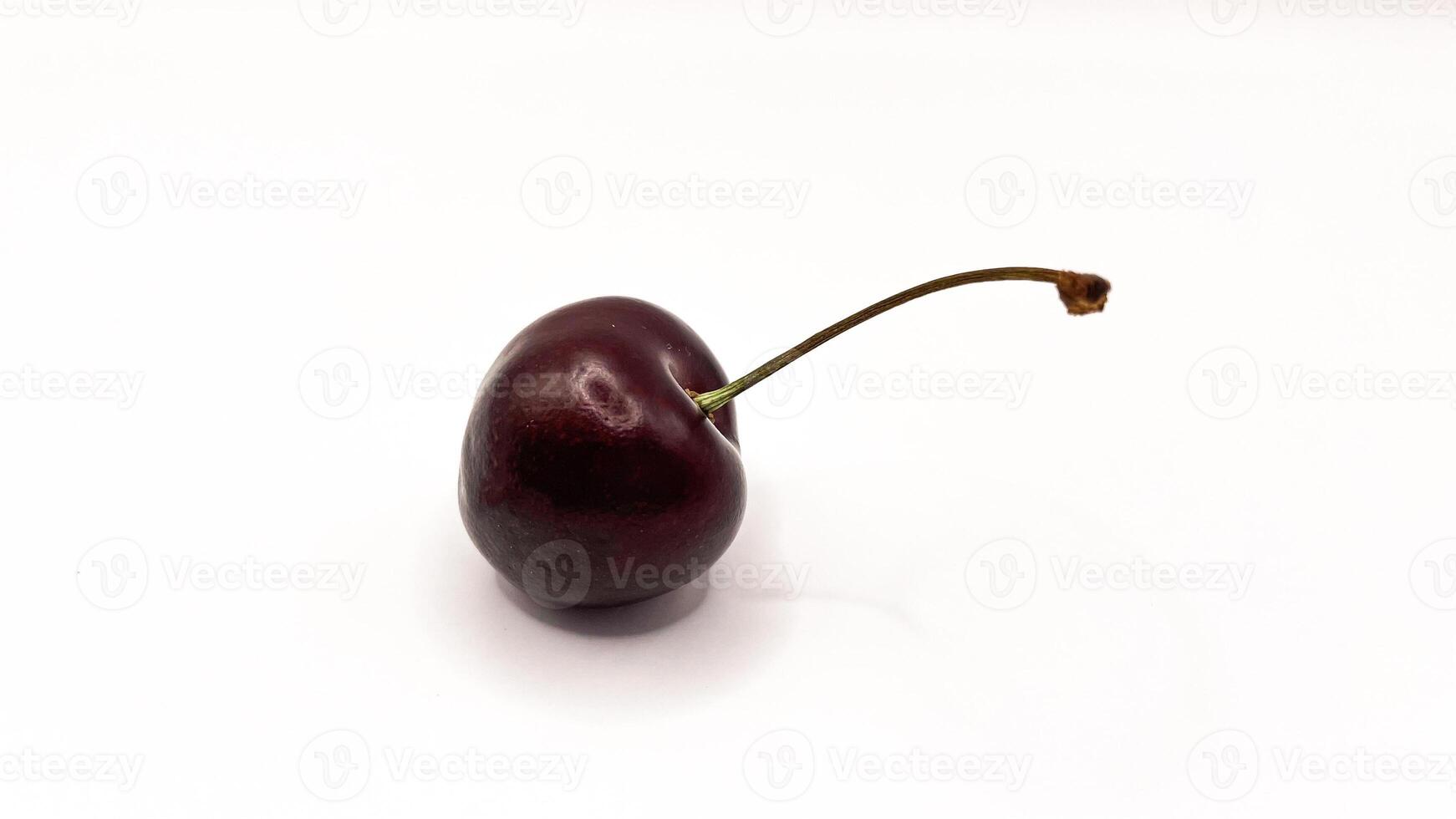 Fresh red cherry fruits on a plate on a white background in close-up. High quality photos