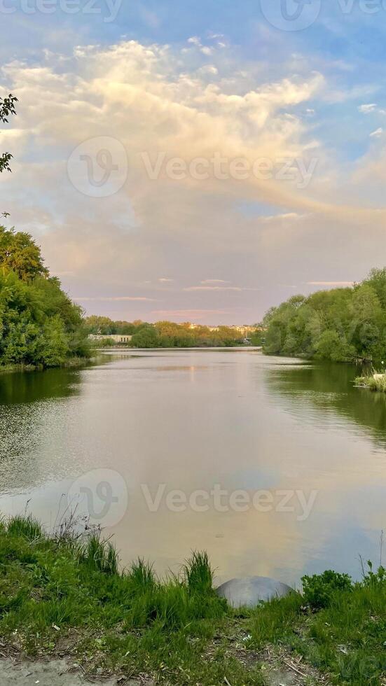 A landscape with a view of the river and the sunset photo