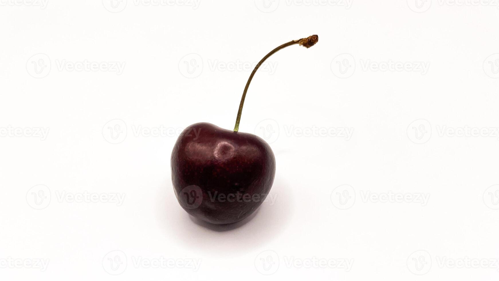 Fresh red cherry fruits on a plate on a white background in close-up. High quality photos