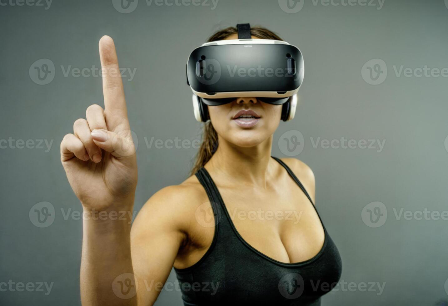Young Woman Using VR Headset Pointing Upward photo