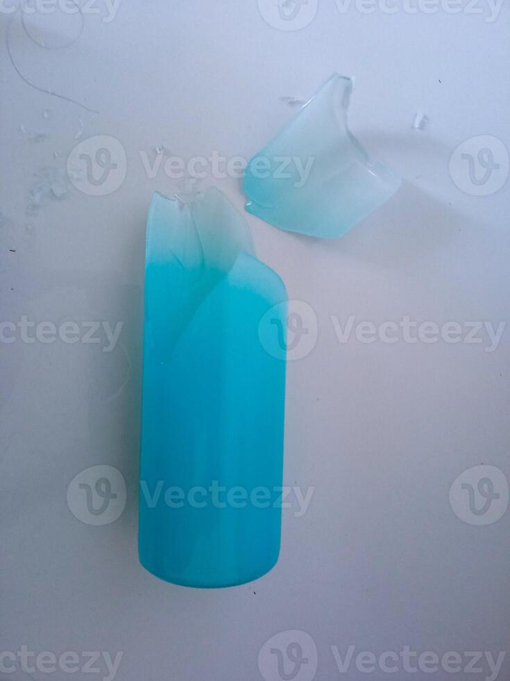a glass bottle that broke when it fell photo