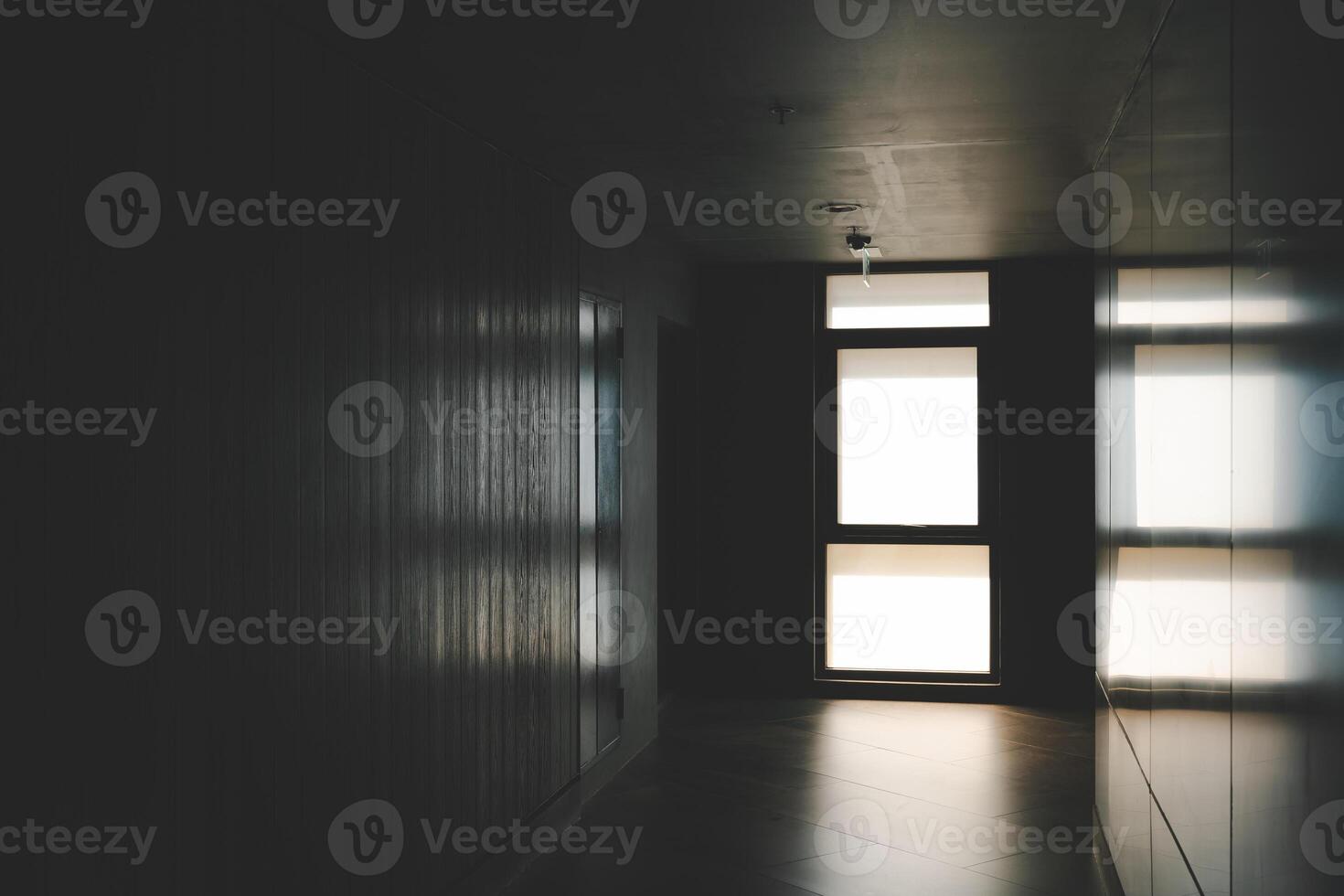 A beautiful window with soft light. Abandoned hallway with light at the end shining photo