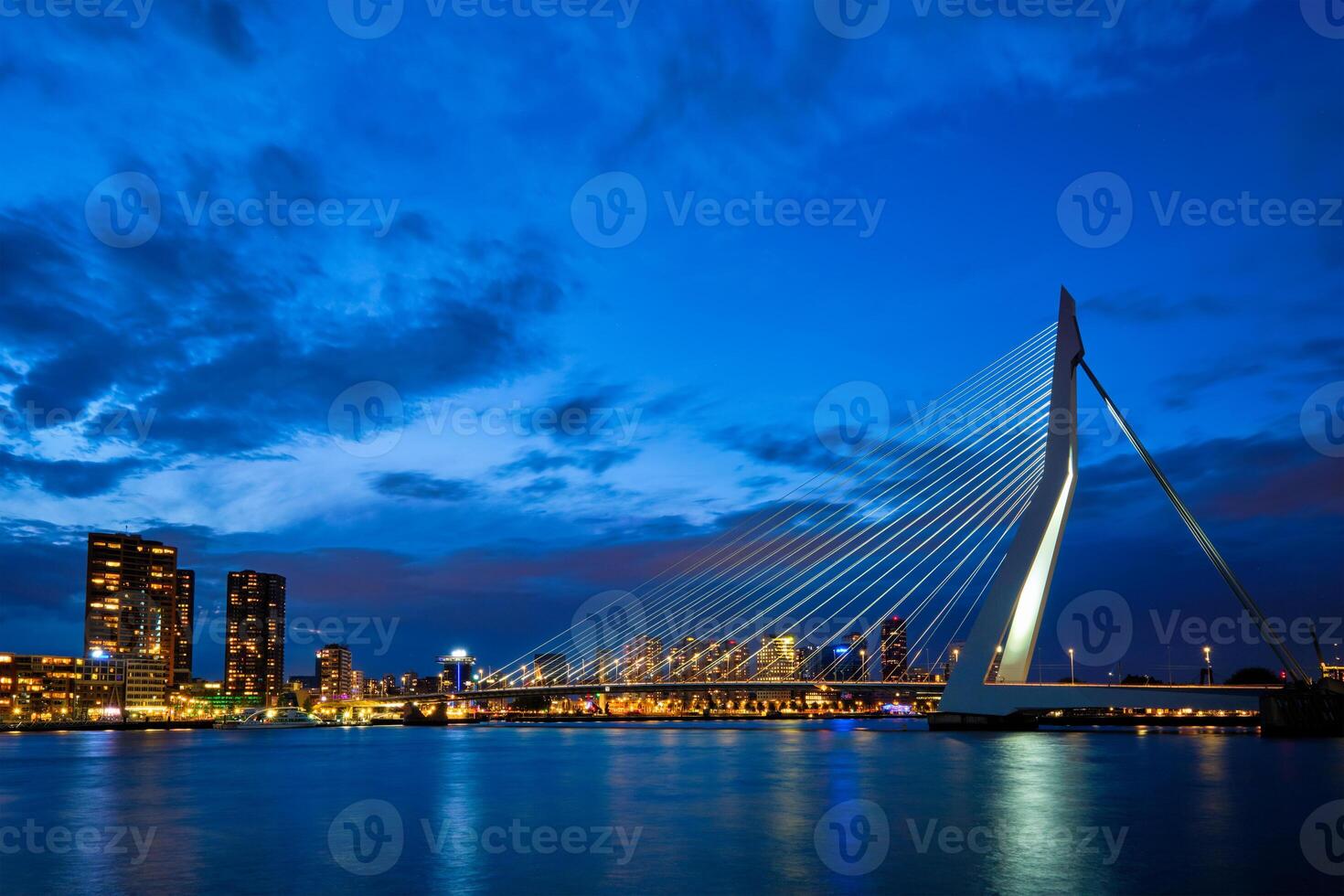 View of Erasmus Bridge Erasmusbrug and Rotterdam skyline. Rotterdam, Netherlands photo