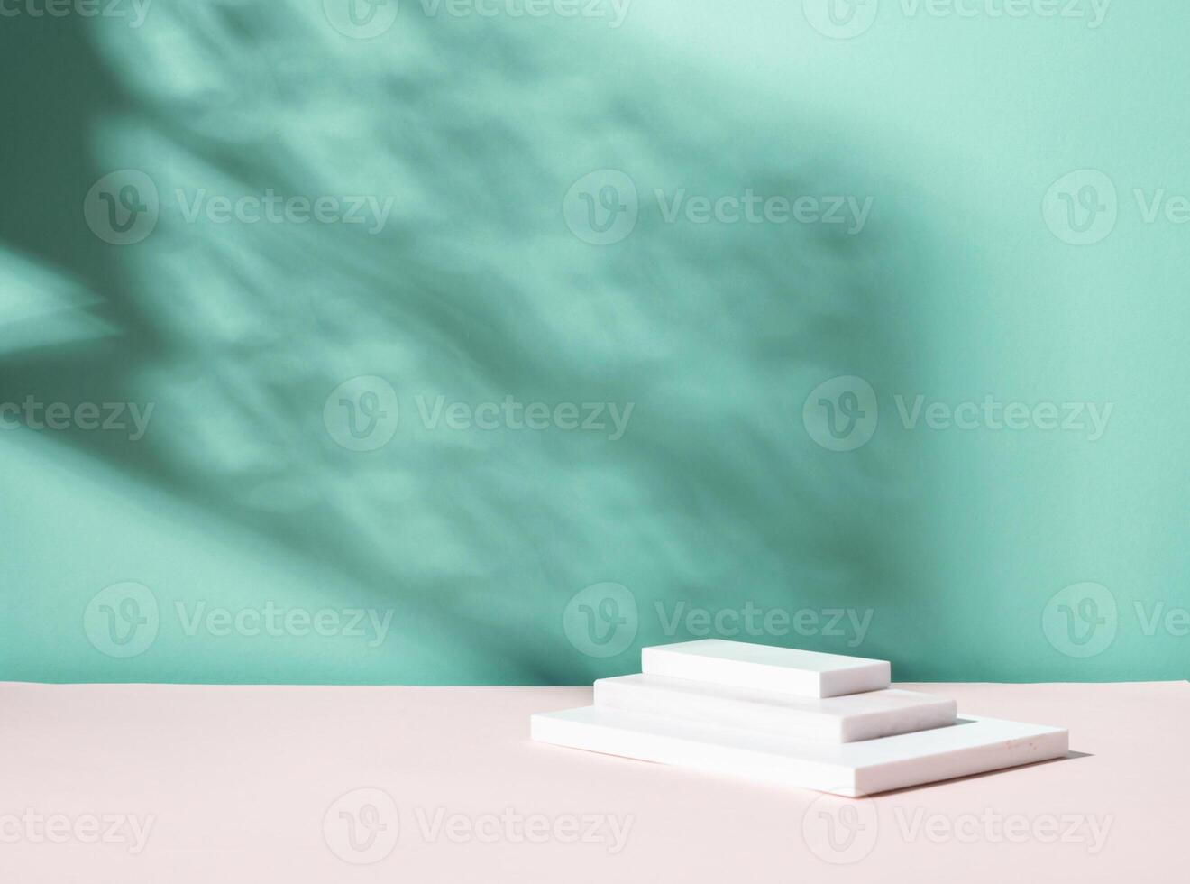 Abstract podium pedestal from white marble, blue menthol empty background deep shadows from plant photo