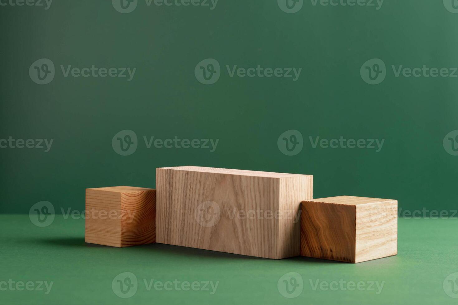 Abstract empty podium wooden geometric shapes, green background. Template for demonstrating products photo