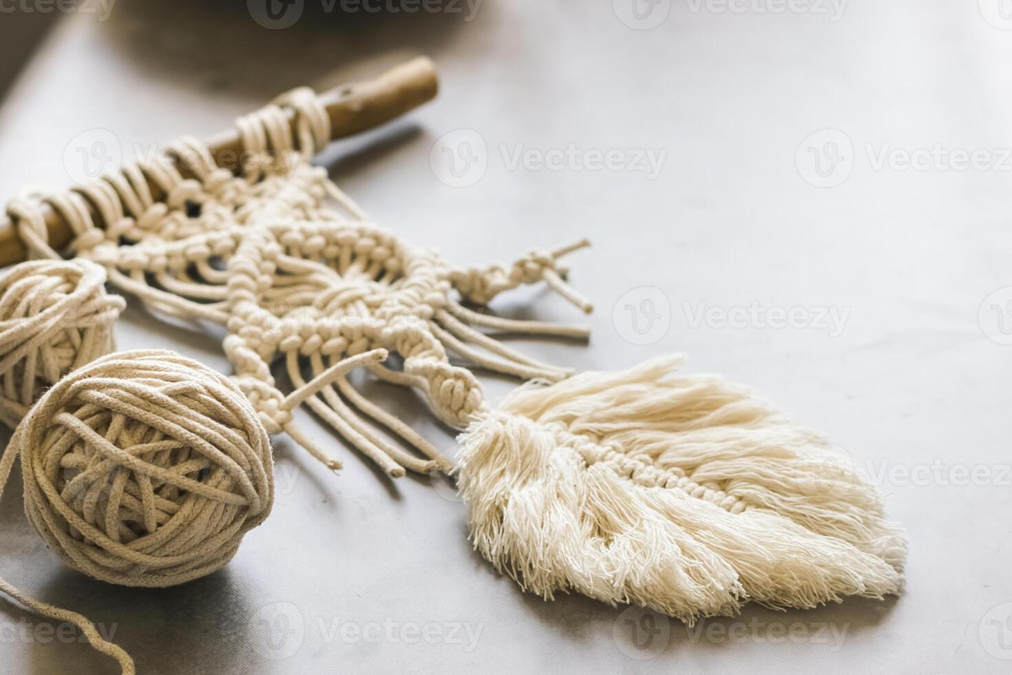 Handmade knitting macrame. Boho lifestyle. Hobby hobby concept. Selective focus. Horizontal frame photo