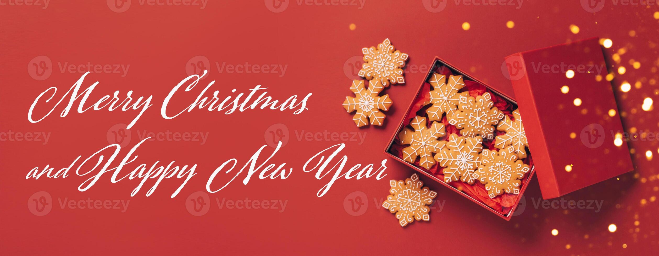 Christmas gingerbread cookies red box on a red festive background with sparkles and serpentine photo