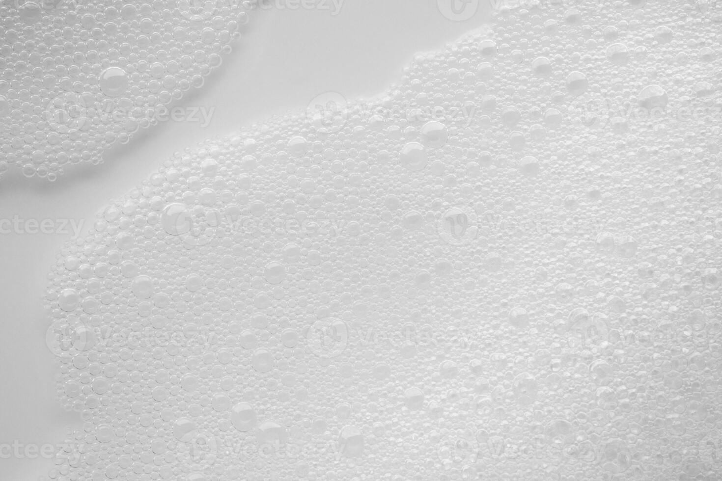 Abstract white soap foam bubbles texture on white background photo