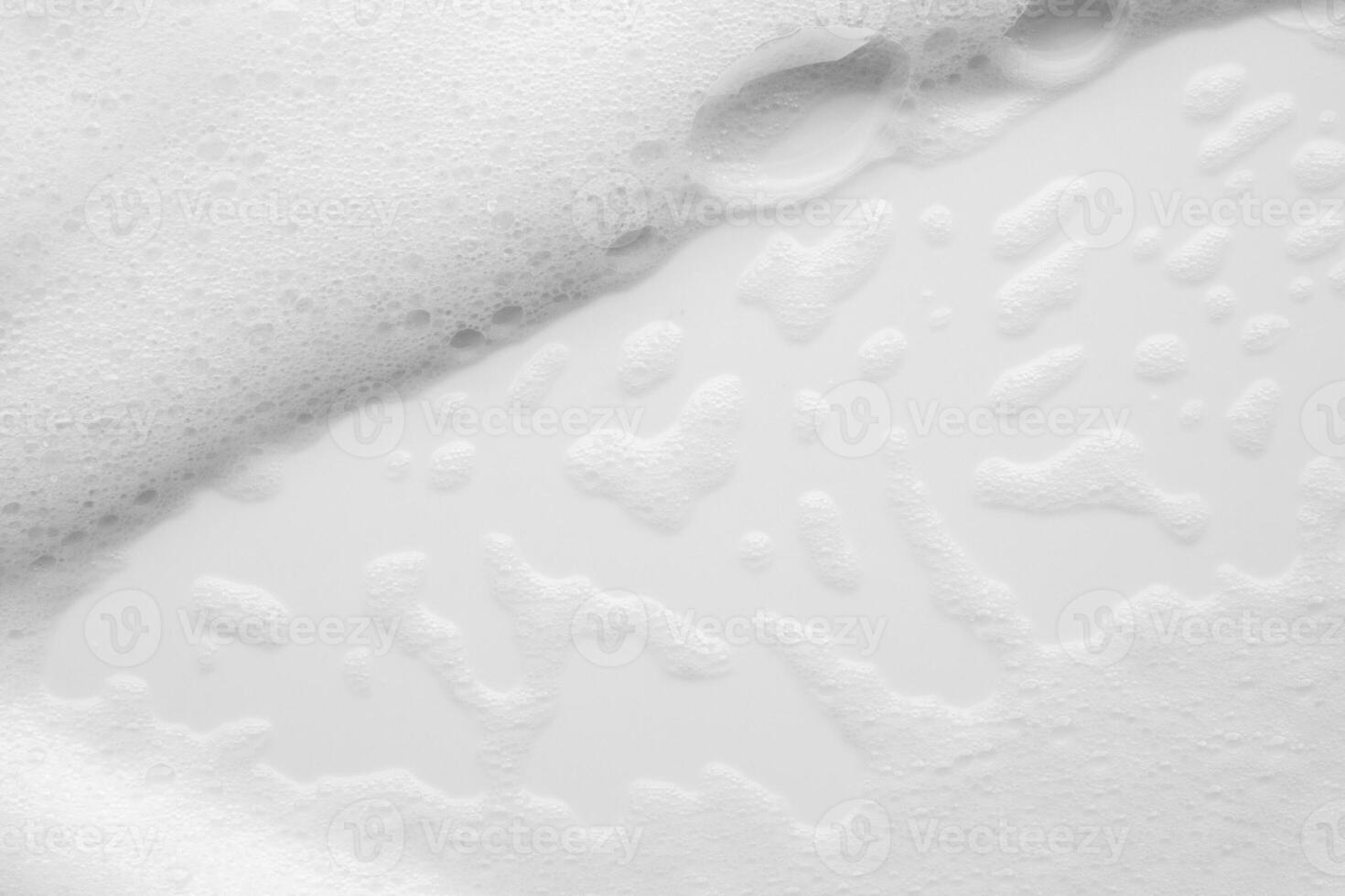 Abstract white soap foam bubbles texture on white background photo