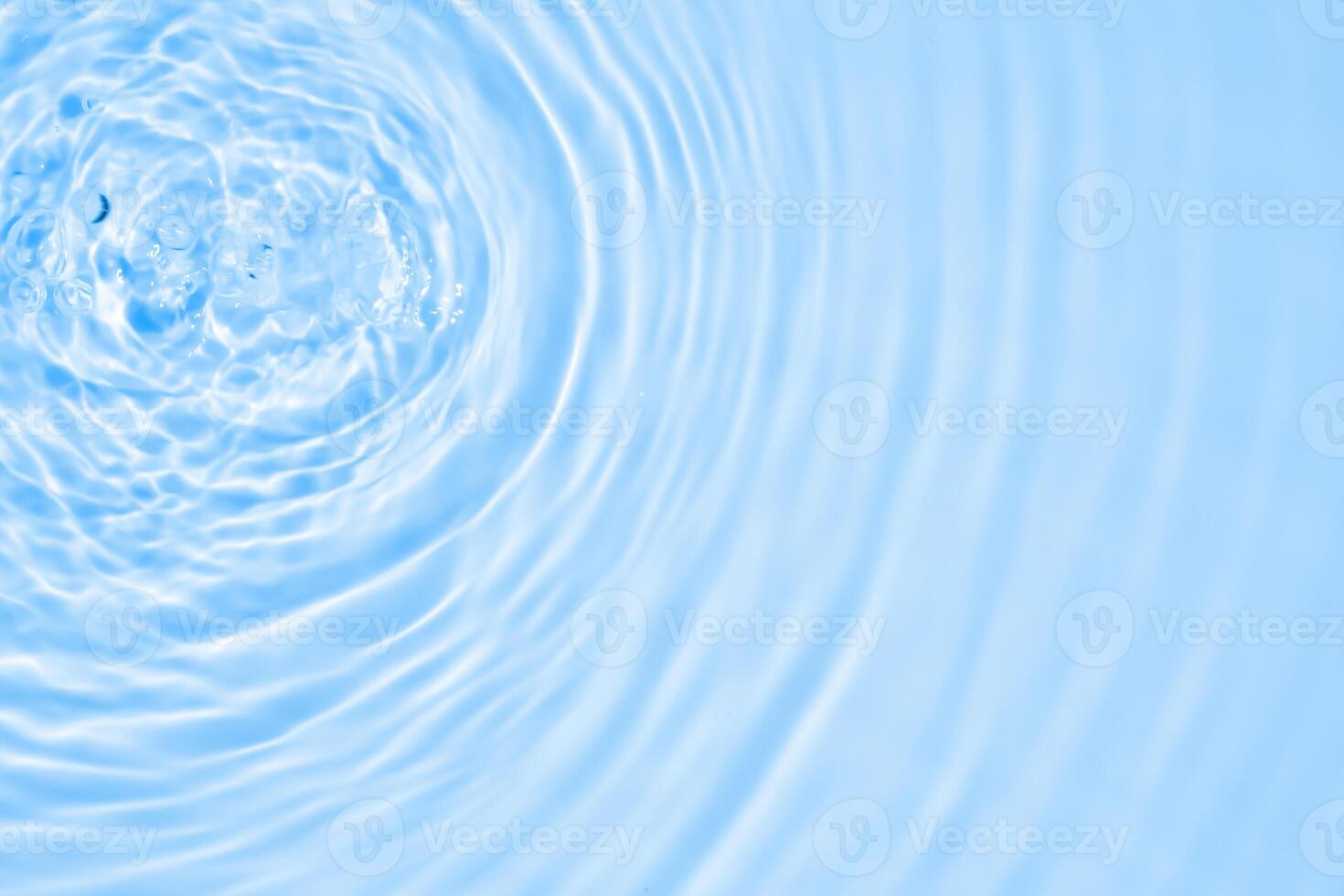 Abstract transparent water shadow surface texture natural ripple on blue background photo