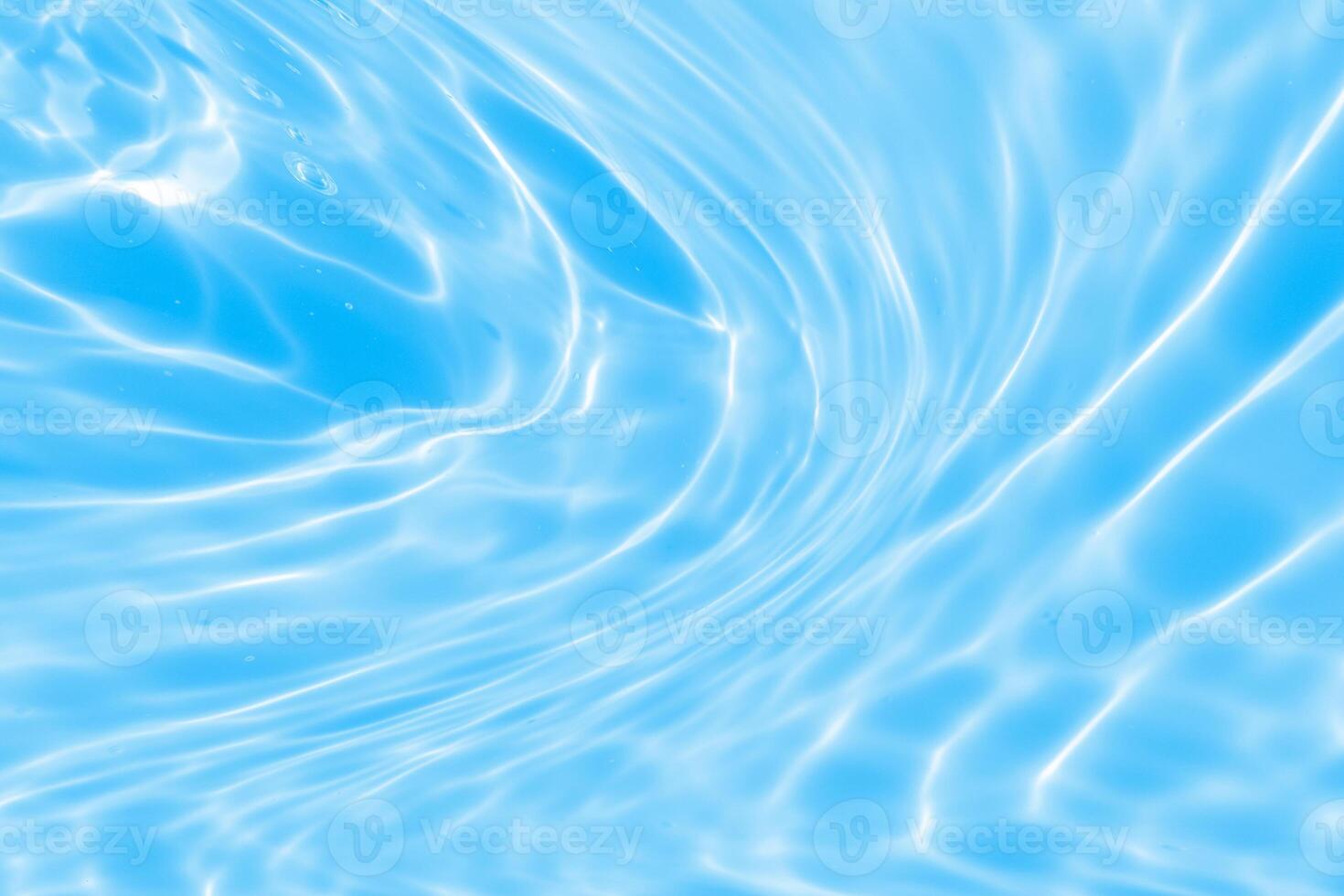 Abstract transparent water shadow surface texture natural ripple on blue background photo