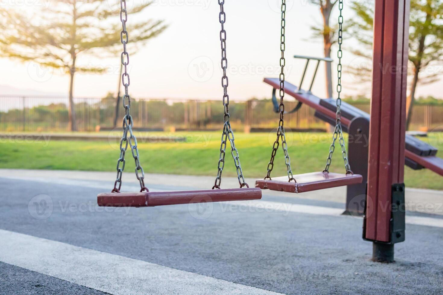 Empty chain swing in the playground photo
