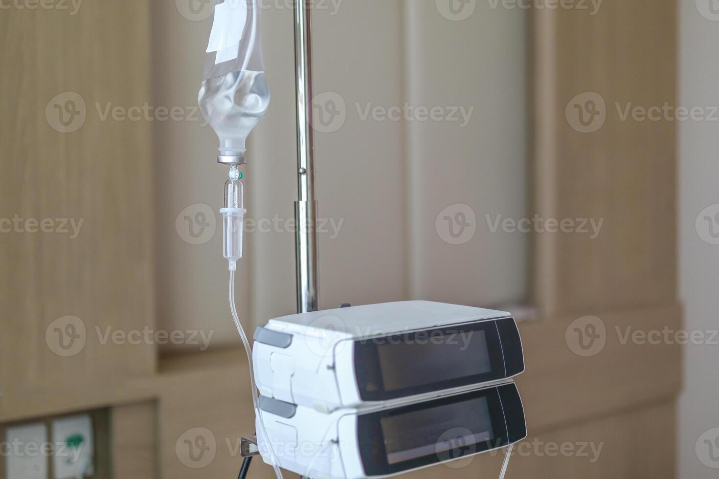 Close up medical intravenous IV drip in hospital background photo
