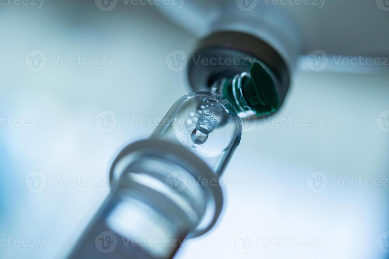 Close up medical intravenous IV drip in hospital background photo
